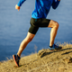 person running in bike shorts